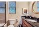 Well-lit bathroom with granite countertop vanity and modern fixtures at 2716 Dundee Pl, Erie, CO 80516