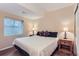 Comfortable bedroom featuring a queen size bed, bedside tables, lamps and lots of natural light at 2716 Dundee Pl, Erie, CO 80516