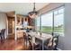 Inviting dining area with golf course views, and a large, unique pendant light at 2716 Dundee Pl, Erie, CO 80516
