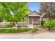 Charming single-Gathering home with stone accents, a well-manicured lawn, and a cozy front porch at 2716 Dundee Pl, Erie, CO 80516