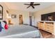 Spacious main bedroom with hardwood floors, a ceiling fan, and a dresser with ample storage at 2716 Dundee Pl, Erie, CO 80516