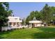 Large backyard with green grass and an outdoor kitchen at 52 Sedgwick Dr, Cherry Hills Village, CO 80113