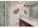 Modern bathroom with marble vanity and glass shower at 52 Sedgwick Dr, Cherry Hills Village, CO 80113