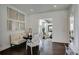 Bright breakfast nook with a view into the living room at 52 Sedgwick Dr, Cherry Hills Village, CO 80113