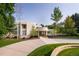 Modern home with landscaped yard and circular driveway at 52 Sedgwick Dr, Cherry Hills Village, CO 80113