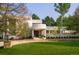 Stunning contemporary home with manicured lawn and stone wall at 52 Sedgwick Dr, Cherry Hills Village, CO 80113