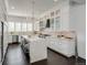 Gourmet kitchen boasting a large marble island and white cabinetry at 52 Sedgwick Dr, Cherry Hills Village, CO 80113