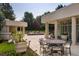 Outdoor dining area with round table and chairs near the pool at 52 Sedgwick Dr, Cherry Hills Village, CO 80113