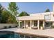 Relaxing poolside patio with lounge chairs and outdoor seating at 52 Sedgwick Dr, Cherry Hills Village, CO 80113