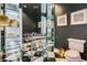 Stylish powder room with black and white checkered floor and marble vanity at 52 Sedgwick Dr, Cherry Hills Village, CO 80113