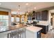 Spacious kitchen featuring modern island, stainless steel appliances, and ample cabinetry at 9075 E 36Th Ave, Denver, CO 80238