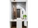 Modern bathroom with sleek vanity, unique lighting fixtures, and stylish decor at 1518 S Columbine St, Denver, CO 80210