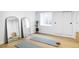 Bright, minimalist bedroom featuring mirrors, storage, and natural light for a calm and inviting space at 1518 S Columbine St, Denver, CO 80210