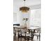 Elegant dining room featuring a modern chandelier, large windows, and a stylish dining set at 1518 S Columbine St, Denver, CO 80210