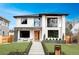 Contemporary two-story home with a well-manicured lawn, stylish entryway, and ample natural light at 1518 S Columbine St, Denver, CO 80210