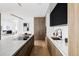 Bright, modern kitchen showcasing a waterfall island, stainless steel appliances, a stylish faucet, and custom cabinetry at 1518 S Columbine St, Denver, CO 80210