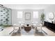 Bright living room with modern decor, stylish furniture, and a unique glass wine display at 1518 S Columbine St, Denver, CO 80210