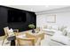 Cozy living room with chic black accent wall, complemented by comfortable seating and stylish decor at 1518 S Columbine St, Denver, CO 80210