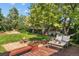 Backyard featuring fire pit, furniture and mature trees at 16563 E Kansas Pl, Aurora, CO 80017