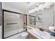 Bathroom featuring a tub and shower combo with a modern vanity at 16563 E Kansas Pl, Aurora, CO 80017