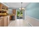 Bright dining area featuring tile floors, sliding glass doors to deck and natural light at 16563 E Kansas Pl, Aurora, CO 80017