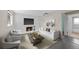 Cozy living room featuring a fireplace, contemporary furniture, and ample space at 16563 E Kansas Pl, Aurora, CO 80017
