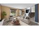 Bright living room with neutral walls, large window, comfortable seating and staircase at 16563 E Kansas Pl, Aurora, CO 80017