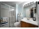 Bright bathroom with glass enclosed shower and updated sink and vanity at 611 Branding Iron Ln, Castle Rock, CO 80104