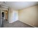 This bedroom features neutral walls, plush carpeting, and a double door closet at 611 Branding Iron Ln, Castle Rock, CO 80104