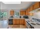 Bright kitchen featuring wood cabinets, white countertops, and stainless steel appliances at 611 Branding Iron Ln, Castle Rock, CO 80104