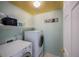 This functional laundry room is equipped with modern appliances and ample shelving at 611 Branding Iron Ln, Castle Rock, CO 80104