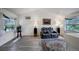 Cozy living room features vaulted ceilings, hardwood floors, and abundant natural light at 611 Branding Iron Ln, Castle Rock, CO 80104