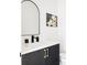 Modern bathroom with dark vanity and a white countertop at 6202 N Galena St, Denver, CO 80238