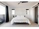 Bedroom with a ceiling fan and sliding door to balcony at 6202 N Galena St, Denver, CO 80238