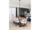 Dining area with a long live-edge table and modern chairs at 6202 N Galena St, Denver, CO 80238