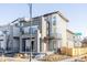 Modern three-story home with gray siding and a sleek design at 6202 N Galena St, Denver, CO 80238