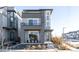 Modern three-story home with gray siding and a sleek design at 6202 N Galena St, Denver, CO 80238