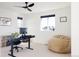 Modern home office with a standing desk, comfortable seating, and plenty of light at 6202 N Galena St, Denver, CO 80238