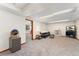 A finished basement featuring neutral carpet, white walls, recessed lighting, and entertainment area with furniture at 4390 S Sheridan Blvd, Littleton, CO 80123