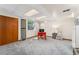 A finished basement featuring neutral carpet, white walls, recessed lighting, and an office area with a red desk at 4390 S Sheridan Blvd, Littleton, CO 80123