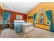 Comfortable primary bedroom features vaulted ceiling, large windows, natural light, and a calming color palette at 4390 S Sheridan Blvd, Littleton, CO 80123