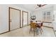 Bright breakfast nook with tile flooring, natural light from windows and doors, and a cozy table setting at 4390 S Sheridan Blvd, Littleton, CO 80123