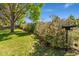 View of a mailbox and bushes with a lush lawn and mature tree providing a serene setting at 4390 S Sheridan Blvd, Littleton, CO 80123
