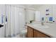 Bright bathroom featuring white finishes and tile surround at 9864 S Garland Ct, Littleton, CO 80127