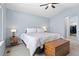 Bedroom featuring a queen-sized bed and a large window at 9864 S Garland Ct, Littleton, CO 80127