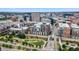 Aerial view of a modern building complex near a river and city at 1401 Wewatta St # 204, Denver, CO 80202