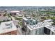 Aerial perspective showcasing a residential building near a stadium and amusement park at 1401 Wewatta St # 204, Denver, CO 80202