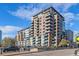 Modern building exterior with numerous balconies at 1401 Wewatta St # 204, Denver, CO 80202