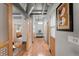 Bright hallway with hardwood floors and modern sliding doors at 1401 Wewatta St # 204, Denver, CO 80202