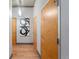 Bright hallway with hardwood floors and modern doors at 1401 Wewatta St # 204, Denver, CO 80202